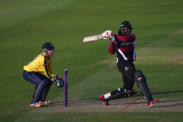 TAUNTON, ENGLAND - JUNE 05: Chris Gayle of Somerset hits to the legside as wicketkeeper Adam Wheater of Hampshire looks on during the NatWest T20 Blast match between Somerset and Hampshire at The County Ground on June 5, 2015 in Taunton, England.  (Photo by Michael Steele/Getty Images)