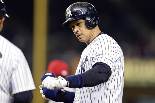 New York Yankees' Alex Rodriguez, right, reacts after hitting a single during the eighth inning of a baseball game against the Los Angeles Angels Friday, June 5, 2015, in New York. Alex Rodriguez moved past Barry Bonds for second place on the career RBIs list and got four hits Friday night as the New York Yankees built a huge lead, then scrambled to hold off the Los Angeles Angels 8-7 for their fourth straight victory.  (AP Photo/Frank Franklin II)