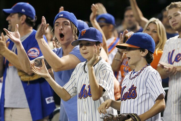 New York Mets fans cheer on John Mayberry Jr., after his two-run home run against the Arizona Diamondbacks during the ninth inning of a baseball game Thursday, June 4, 2015, in Phoenix.The Mets defeated the Diamondbacks 6-2. (AP Photo/Ross D. Franklin)