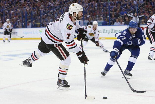 Jun 3, 2015; Tampa, FL, USA; Chicago Blackhawks defenseman Brent Seabrook (7) shoots the puck against Tampa Bay Lightning defenseman Victor Hedman (77) in the third period in game one of the 2015 Stanley Cup Final at Amalie Arena. Mandatory Credit: Kim Klement-USA TODAY Sports