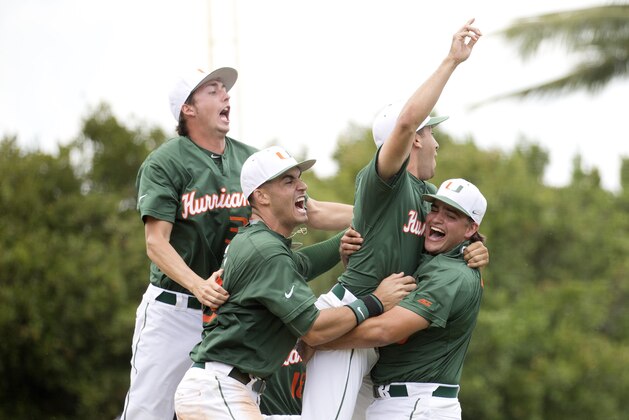 Miami Hurricanes celebrate after the super regionals game against VCU of the NCAA college baseball tournament, Saturday, June 6, 2015, in Coral Gables, Fla. Miami won 10-3. (AP Photo/J Pat Carter)