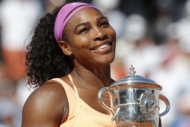Serena Williams of the U.S. holds the trophy after winning the final of the French Open tennis tournament against Lucie Safarova of the Czech Republic in three sets, 6-3, 6-7, 6-2, at the Roland Garros stadium, in Paris, France, Saturday, June 6, 2015. (AP Photo/Michel Euler)