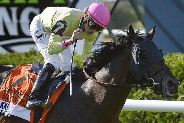 Jockey Irad Ortiz Jr. reacts after guiding Slumber (7) to win the 114th running of the Knob Creek Manhattan horse race at Belmont Park, Saturday, June 6, 2015, in Elmont, N.Y. (AP Photo/Bill Kostroun)