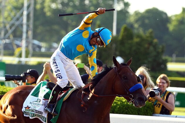 ELMONT, NY - JUNE 06:  Victor Espinoza, celebrates atop American Pharoah #5, after winning the 147th running of the Belmont Stakes at Belmont Park on June 6, 2015 in Elmont, New York. With the wins American Pharoah becomes the first horse to win the Triple Crown in 37 years.  (Photo by Al Bello/Getty Images)