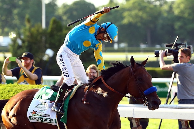 ELMONT, NY - JUNE 06:  Victor Espinoza, celebrates atop American Pharoah #5, after winning the 147th running of the Belmont Stakes at Belmont Park on June 6, 2015 in Elmont, New York. With the wins American Pharoah becomes the first horse to win the Triple Crown in 37 years.  (Photo by Al Bello/Getty Images)