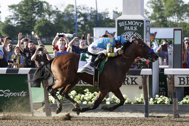 American Pharoah (5) with Victor Espinoza up crosses the finish line to win the 147th running of the Belmont Stakes horse race at Belmont Park, Saturday, June 6, 2015, in Elmont, N.Y. American Pharoah is the first horse to win the Triple Crown since Affirmed won it in 1978. (AP Photo/Seth Wenig)