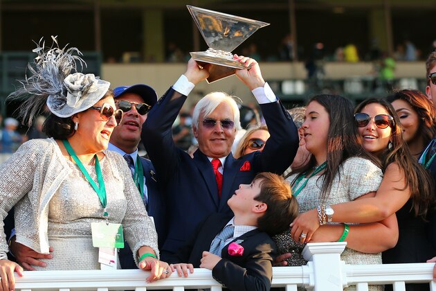 ELMONT, NY - JUNE 06:  Bob Baffert, trainer of American Pharoah #5, celebrates as his sun Bode looks on after winning the 147th running of the Belmont Stakes at Belmont Park on June 6, 2015 in Elmont, New York. With the wins American Pharoah becomes the first horse to win the Triple Crown in 37 years. (Photo by Elsa/Getty Images)