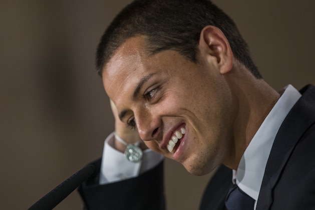 Mexico's international soccer player Javier Hernandez 'Chicharito', gestures at a press conference during his official presentation at the Santiago Bernabeu stadium in Madrid, Spain, Monday, Sept. 1, 2014, after signing for Real Madrid. (AP Photo/Andres Kudacki)