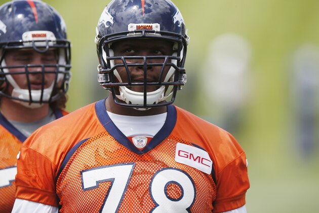In this photo taken Wednesday, May 27, 2015, Denver Broncos offensive tackle Ryan Clady waits to take part in drills during an NFL football organized team activity at the team's headquarters in Englewood, Colo. Broncos officials announced Thursday, May 28, 2015, that Clady tore his left ACL while taking part in Wednesday's session, an injury that is likely to shelve the veteran offensive lineman for the season. (AP Photo/David Zalubowski)