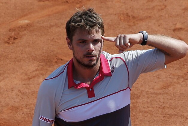 Switzerland's Stan Wawrinka reacts after defeating France's Jo-Wilfried Tsonga during their semifinal match of the French Open tennis tournament at the Roland Garros stadium, Friday, June 5, 2015 in Paris. Wawrinka won 6-3, 6-7, 7-6, 6-4. (AP Photo/Christophe Ena)