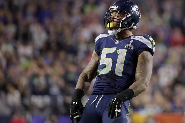Seattle Seahawks outside linebacker Bruce Irvin (51) pop out his mouthpiece during the second half of NFL Super Bowl XLIX football game Sunday, Feb. 1, 2015, in Glendale, Ariz. (AP Photo/Matt Rourke)