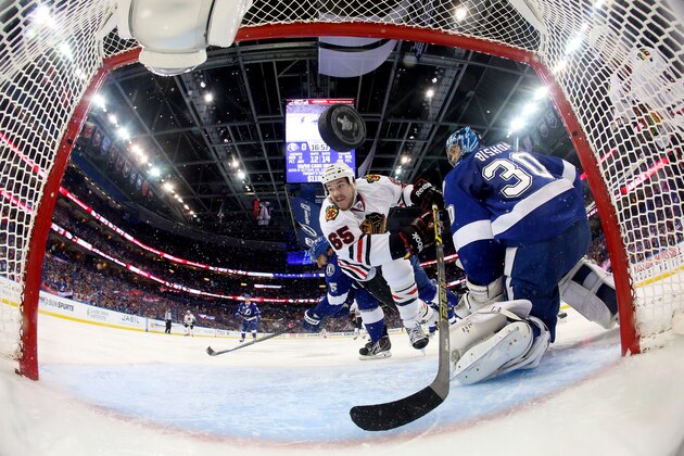 TAMPA, FL - JUNE 06:  Andrew Shaw #65 of the Chicago Blackhawks scores a goal against Ben Bishop #30 of the Tampa Bay Lightning during the second period in Game Two of the 2015 NHL Stanley Cup Final at Amalie Arena on June 6, 2015 in Tampa, Florida.  (Photo by Bruce Bennett/Getty Images)