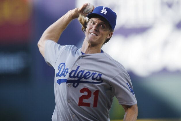 Los Angeles Dodgers starting pitcher Zack Greinke works against the Colorado Rockies in the first inning of Game 2 of a baseball doubleheader Tuesday, June 2, 2015, in Denver. (AP Photo/David Zalubowski)