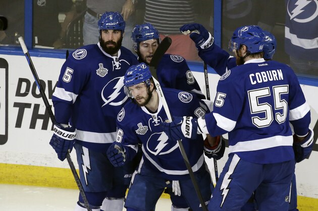 Tampa Bay Lightning right wing Nikita Kucherov (86) celebrates after scoring with teammates against the Chicago Blackhawks during the second period in Game 2 of the NHL hockey Stanley Cup Final on Saturday, June 6, 2015, in Tampa Fla. (AP Photo/John Raoux)