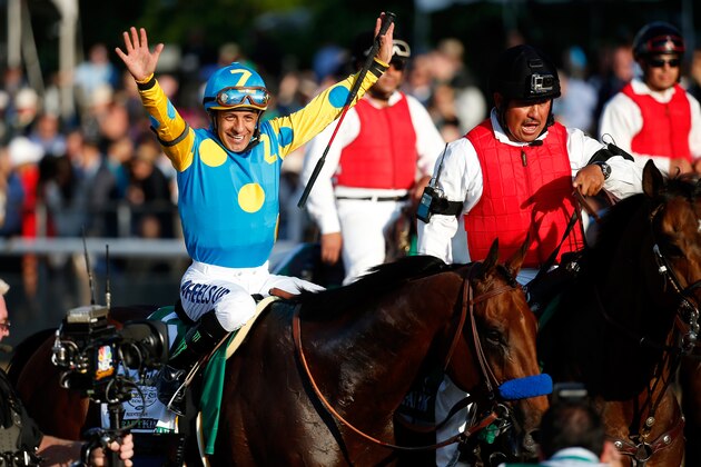ELMONT, NY - JUNE 06:  Victor Espinoza, celebrates atop American Pharoah #5, after winning the 147th running of the Belmont Stakes at Belmont Park on June 6, 2015 in Elmont, New York. With the wins American Pharoah becomes the first horse to win the Triple Crown in 37 years.  (Photo by Rob Carr/Getty Images)