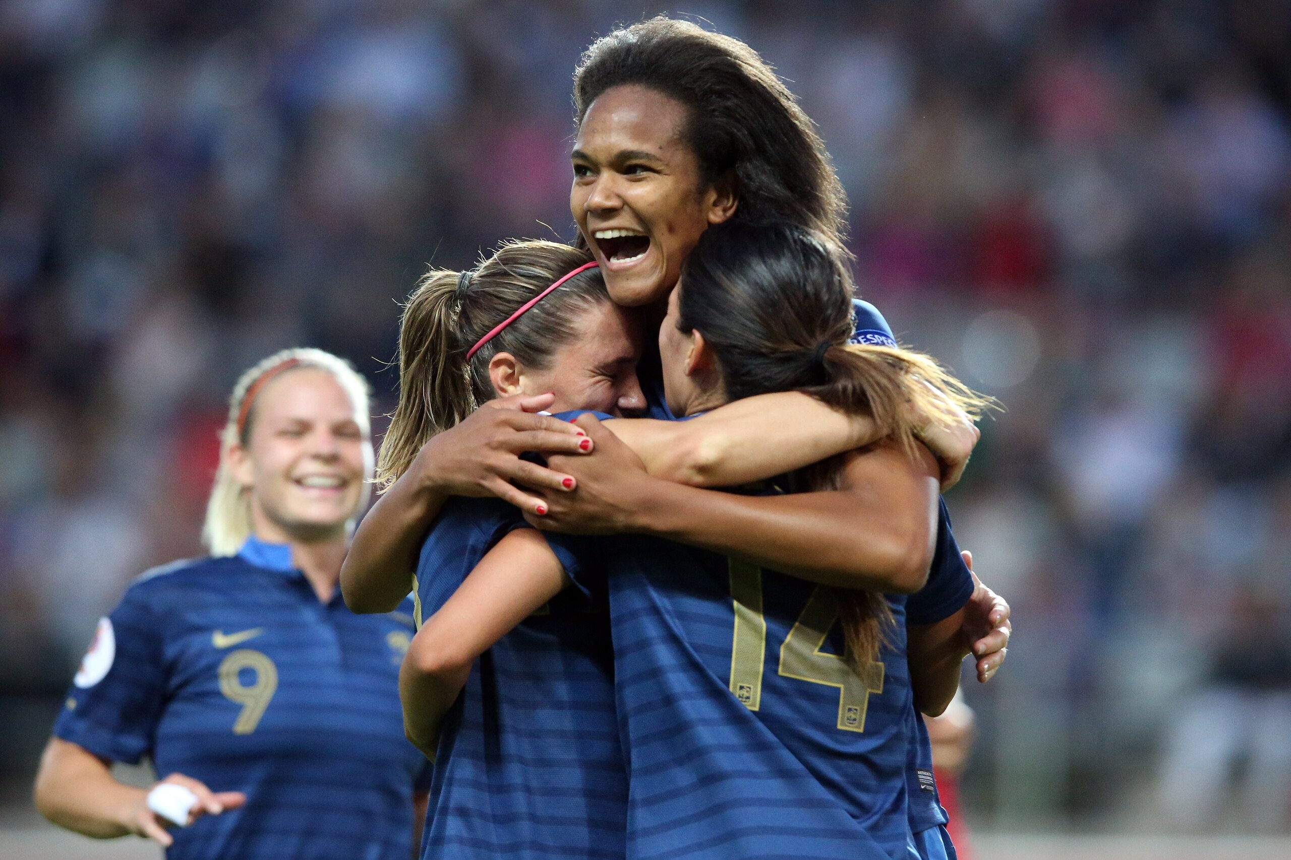 LINKOPING, SWEDEN - JULY 18: Wendine Renard of France(C) celebrates the third goal with Camille Abily (L) anc Louisa Necib of France (R) during the UEFA Women's EURO 2013 Group C match between France
and England at Linkoping Arena on July 18, 2013 in Linkoping, Sweden. (Photo by Christof Koepsel/Getty Images)