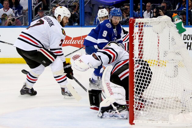 TAMPA, FL - JUNE 06:  Tyler Johnson #9 of the Tampa Bay Lightning takes a shot on Corey Crawford #50 of the Chicago Blackhawks during Game Two of the 2015 NHL Stanley Cup Final at Amalie Arena on June 6, 2015 in Tampa, Florida.  (Photo by Bruce Bennett/Getty Images)