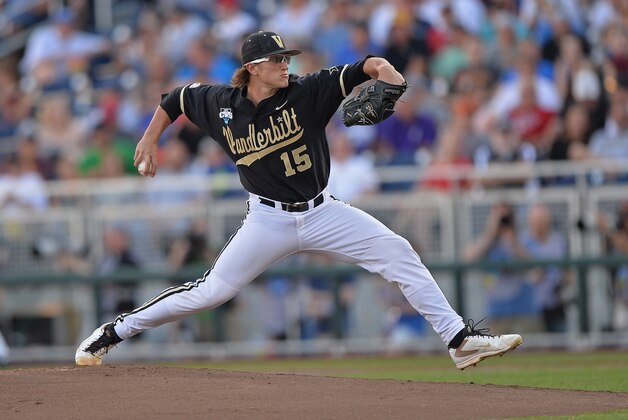 OMAHA, NE - JUNE 25:  Pitcher Carson Fulmer #15 of the Vanderbilt Commodores delivers a pitch against the Virginia Cavaliers in the first inning during game three of the College World Series Championship Series on June 25, 2014 at TD Ameritrade Park in Omaha, Nebraska.  (Photo by Peter Aiken/Getty Images)