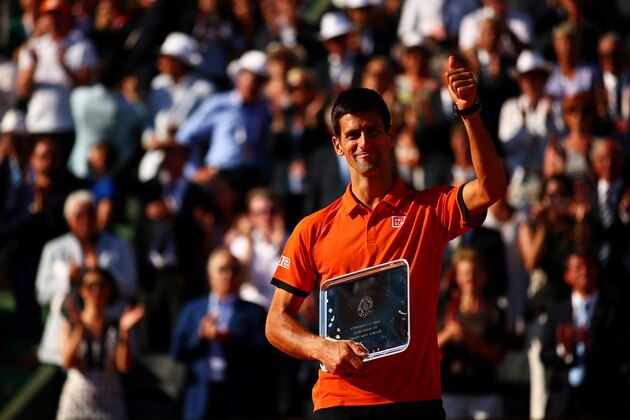 PARIS, FRANCE - JUNE 07:  Novak Djokovic of Serbia salutes the crowd after collecting the runners up trophy after defeat in the Men's Singles Final against Stanislas Wawrinka of Switzerland on day fifteen of the 2015 French Open at Roland Garros on June 7, 2015 in Paris, France.  (Photo by Dan Istitene/Getty Images)