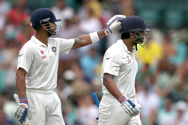 India's Murali Vijay, right, gets a pat on his head from his captain Virat Kohli after he was caught behind for 80 runs on the fifth day of their cricket test match in Sydney, Saturday, Jan. 10, 2015. (AP Photo/Rick Rycroft) India's Murali Vijay, right, gets a pat on his head from his captain Virat Kohli after he was caught behind for 80 runs on the fifth day of their cricket test match in Sydney, Saturday, Jan. 10, 2015. (AP Photo/Rick Rycroft)