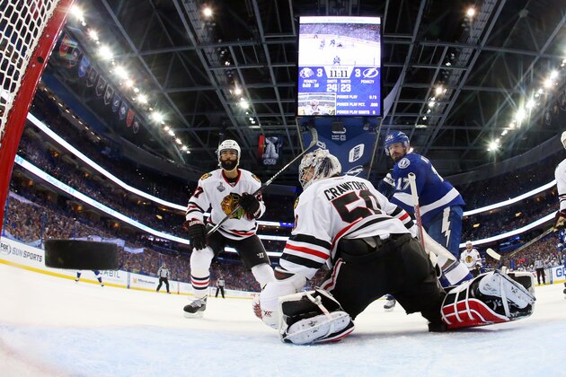 Chicago Blackhawks goalie Corey Crawford watches as Tampa Bay Lightning defenseman Jason Garrison's goal flies by during the third period in Game 2 of the NHL hockey Stanley Cup Final on Saturday, June 6, 2015, in Tampa Fla. (Bruce Bennett/Pool Photo via AP)