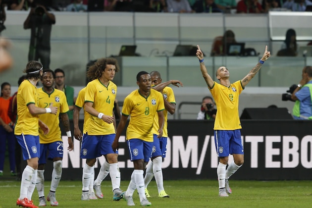 Brazil's Diego Tardelli, right, celebrates after scoring against Mexico during a friendly soccer match in Sao Paulo, Brazil, Sunday, June 7, 2015. Brazil and Mexico are preparing for the Copa America which begins Thursday in Chile. (AP Photo/Andre Penner)
