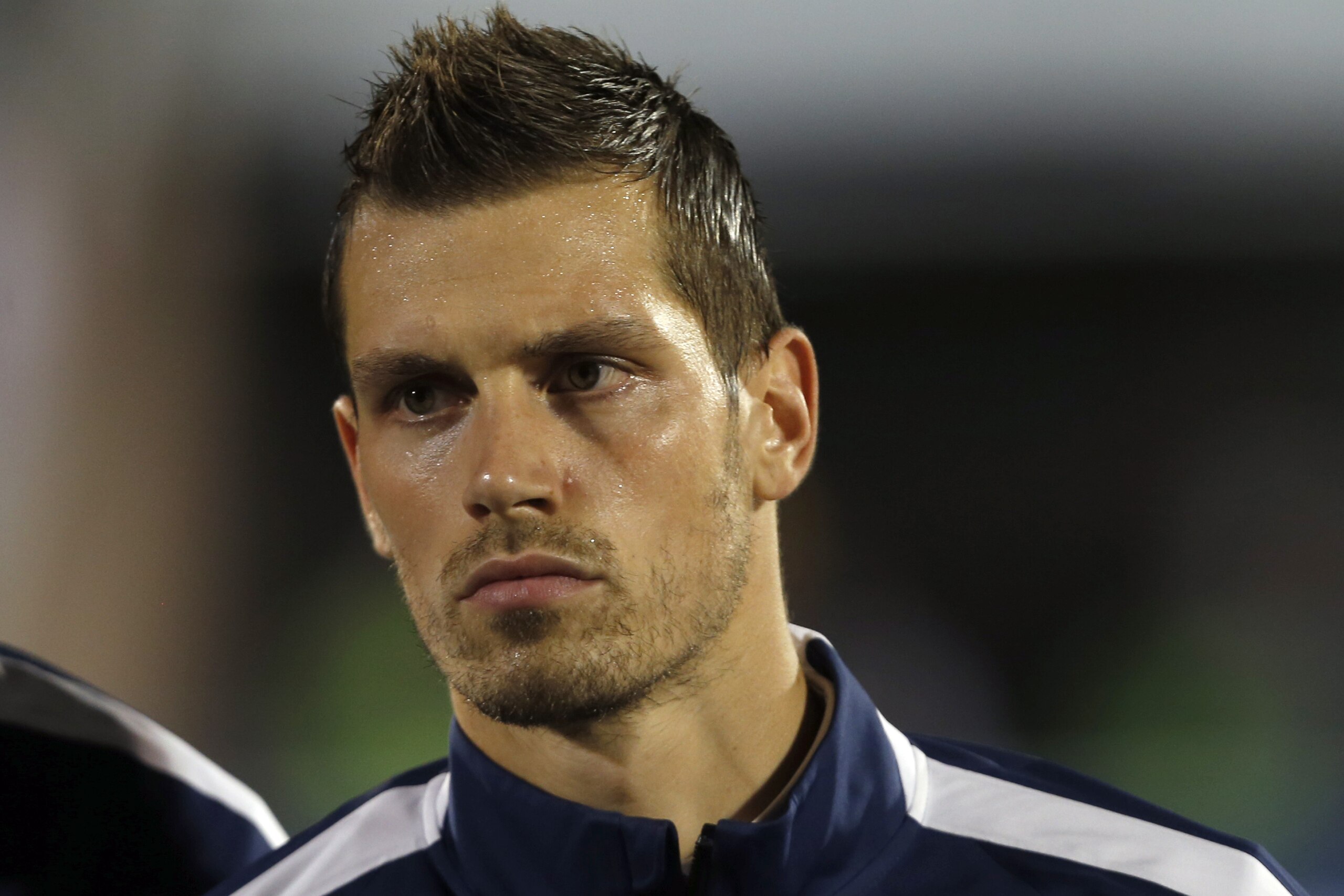 France's Morgan Schneiderlin stands during the playing of his country's national anthem before the start of their international friendly soccer match against Serbia, in Belgrade, Serbia, Sunday, Sept. 7, 2014. (AP Photo/Darko Vojinovic)