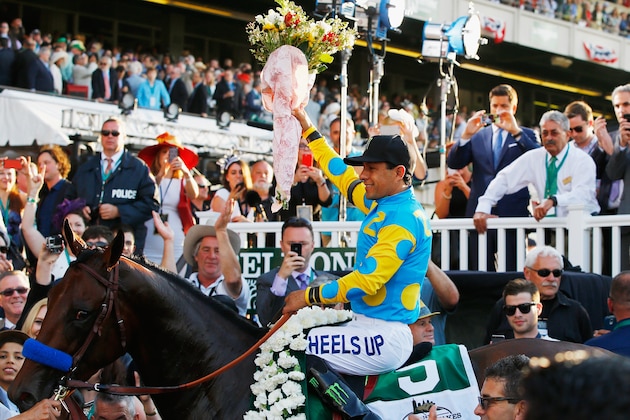 ELMONT, NY - JUNE 06:  Victor Espinoza celebrates atop American Pharoah #5  after winning the147th running of the Belmont Stakes to take the first Triple Crown in 37 years at Belmont Park on June 6, 2015 in Elmont, New York.  (Photo by Al Bello/Getty Images)