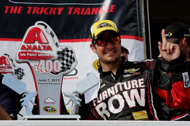 LONG POND, PA - JUNE 07:  Martin Truex Jr., driver of the #78 Furniture Row/Visser Precision Chevrolet, celebrates in Victory Lane after winning the NASCAR Sprint Cup Series Axalta 'We Paint Winners' 400 at Pocono Raceway on June 7, 2015 in Long Pond, Pennsylvania.  (Photo by Jerry Markland/Getty Images)