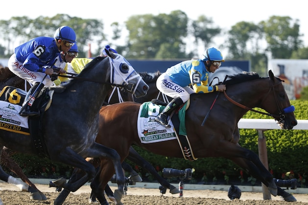 American Pharoah (5) with Victor Espinoza up breaks out early at the start of the 147th running of the Belmont Stakes horse race at Belmont Park, Saturday, June 6, 2015, in Elmont, N.Y. American Pharoah won the race to become the first horse to win the Triple Crown in 37 years.(AP Photo/Kathy Willens)