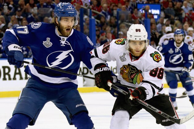 TAMPA, FL - JUNE 06:  Victor Hedman #77 of the Tampa Bay Lightning and Patrick Kane #88 of the Chicago Blackhawks battle during the first period of Game Two of the 2015 NHL Stanley Cup Final at Amalie Arena on June 6, 2015 in Tampa, Florida.  (Photo by Dave Sandford/NHLI via Getty Images)