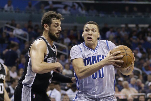 Orlando Magic's Aaron Gordon goes to the basket against San Antonio Spurs' Cory Joseph, left, during the first half of an NBA basketball game, Wednesday, April 1, 2015, in Orlando, Fla. (AP Photo/John Raoux) Orlando Magic's Aaron Gordon goes to the basket against San Antonio Spurs' Cory Joseph, left, during the first half of an NBA basketball game, Wednesday, April 1, 2015, in Orlando, Fla. (AP Photo/John Raoux)
