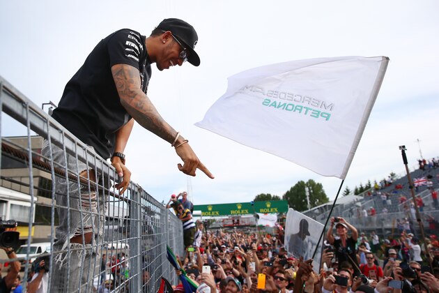 MONTREAL, QC - JUNE 07:  Race winner Lewis Hamilton of Great Britain and Mercedes GP celebrates with the fans during the Canadian Formula One Grand Prix at Circuit Gilles Villeneuve on June 7, 2015 in Montreal, Canada.  (Photo by Mark Thompson/Getty Images)