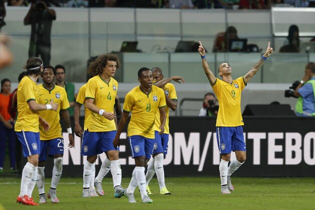 Brazil's Diego Tardelli, right, celebrates after scoring against Mexico during a friendly soccer match in Sao Paulo, Brazil, Sunday, June 7, 2015. Brazil and Mexico are preparing for the Copa America which begins Thursday in Chile. (AP Photo/Andre Penner)