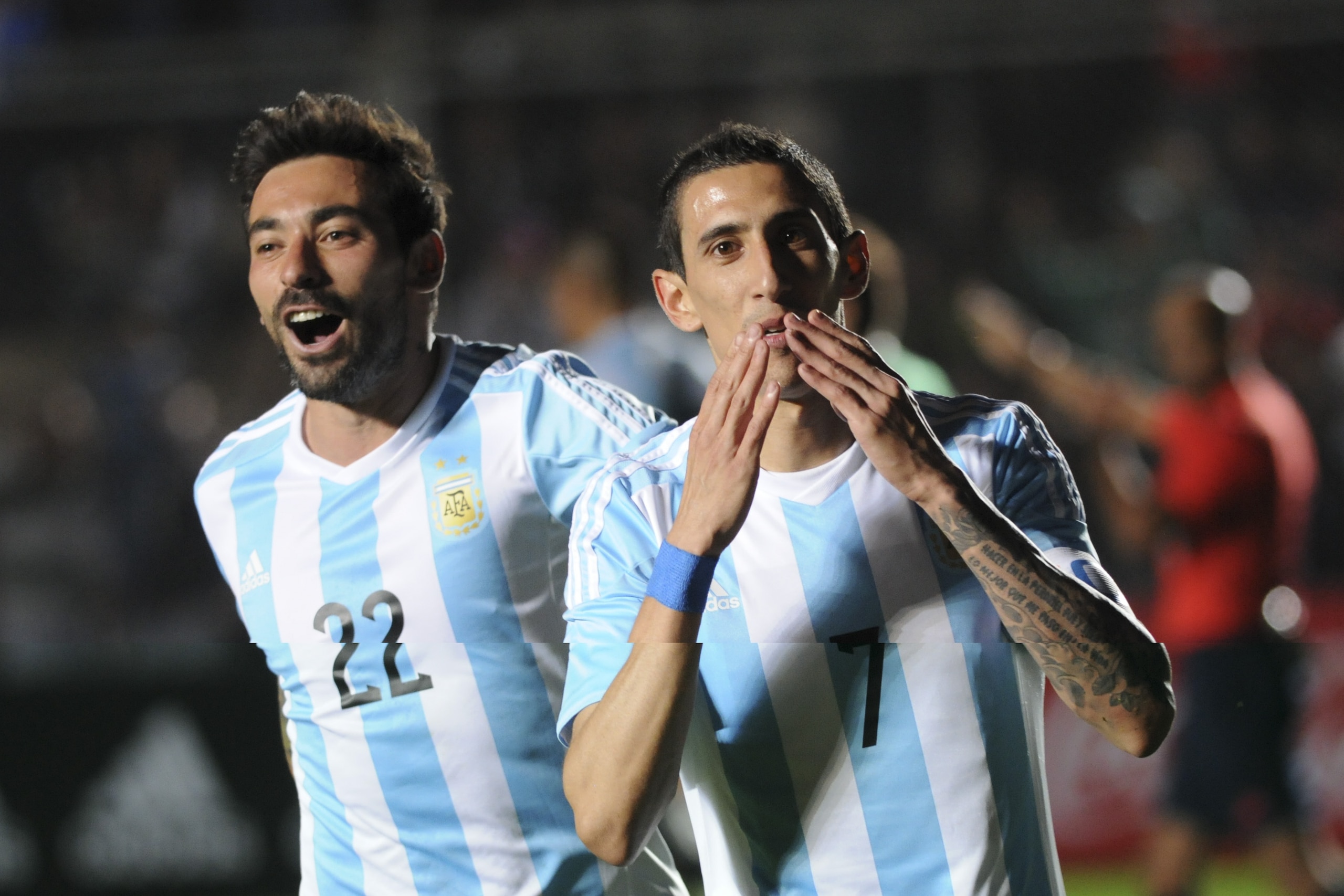 Argentina's Angel Di Maria, right, celebrates with teammate Ezequiel Lavezzi, after scoring against Bolivia, during a friendly international soccer match in San Juan, Argentina, Saturday, June 6, 2015. (AP Photo/Marcos Garcia)