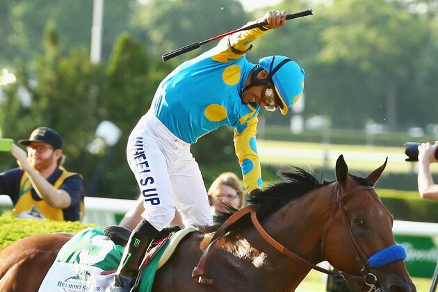 ELMONT, NY - JUNE 06:  Victor Espinoza celebrates atop American Pharoah #5 after winning the 147th running of the Belmont Stakes becoming the first horse in 37 years to win the Triple Crown at Belmont Park on June 6, 2015 in Elmont, New York.  (Photo by Al Bello/Getty Images)