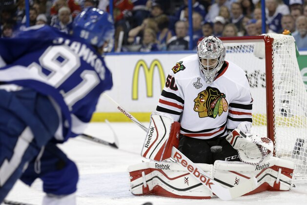Chicago Blackhawks goalie Corey Crawford, right, blocks a shot by Tampa Bay Lightning center Steven Stamkos during the third period in Game 2 of the NHL hockey Stanley Cup Final on Saturday, June 6, 2015, in Tampa Fla. (AP Photo/Chris O'Meara)