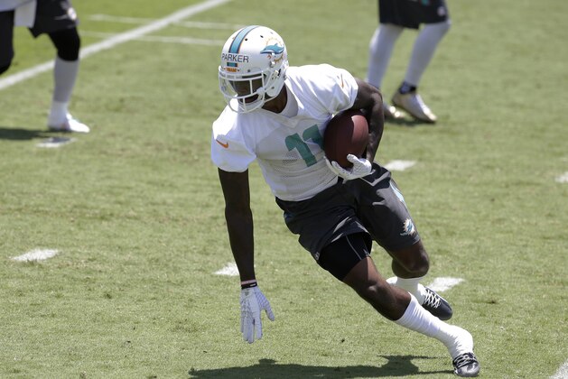 Miami Dolphins wide receiver DeVante Parker (11) runs after catching a pass during an NFL football organized team activity, Monday, June 1, 2015, in Davie, Fla. (AP Photo/Lynne Sladky)