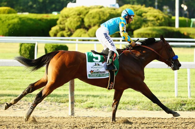 ELMONT, NY - JUNE 06:  Victor Espinoza celebrates atop American Pharoah #5 after winning the 147th running of the Belmont Stakes becoming the first horse in 37 years to win the Triple Crown at Belmont Park on June 6, 2015 in Elmont, New York.  (Photo by Al Bello/Getty Images)