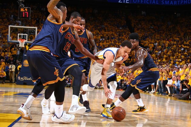 OAKLAND, CA - JUNE 7: Stephen Curry #30 of the Golden State Warriors dribbles against several players of the Cleveland Cavaliers during Game Two of the 2015 NBA Finals on June 7, 2015 at Oracle Arena in Oakland, California. NOTE TO USER: User expressly acknowledges and agrees that, by downloading and or using this photograph, user is consenting to the terms and conditions of Getty Images License Agreement. Mandatory Copyright Notice: Copyright 2015 NBAE (Photo by Nathaniel S. Butler/NBAE via Getty Images)