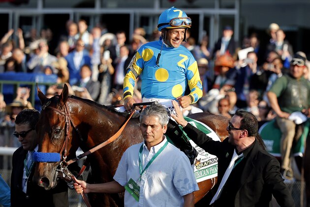 ELMONT, NY - JUNE 06:  Victor Espinoza, celebrates atop American Pharoah #5, after winning the 147th running of the Belmont Stakes at Belmont Park on June 6, 2015 in Elmont, New York. With the win, American Pharoah becomes the first horse to win the Triple Crown in 37 years.  (Photo by Rob Carr/Getty Images)