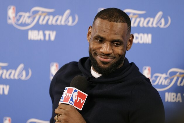 Cleveland Cavaliers forward LeBron James smiles during a news conference after Game 2 of basketball's NBA Finals Sunday, June 7, 2015, in Oakland, Calif. Cleveland won the game in 95-93 in overtime. (AP Photo/Ben Margot)