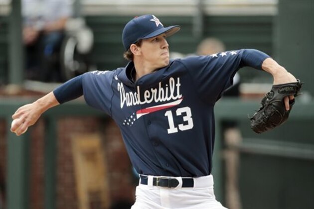 FILE - In this Monday, June 1, 2015, file photo, Vanderbilt starting pitcher Walker Buehler throws against Radford in the first inning of an NCAA regional college baseball game in Nashville, Tenn. Three Commodores--shortstop Dansby Swanson and pitchers Buehler and Carson Fulmer--are among the top prospects entering next week’s MLB draft. (AP Photo/Mark Humphrey, File)