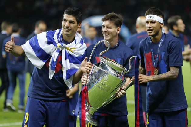 Barcelona's Lionel Messi, centre, Neymar and Luis Suarez, left, celebrate with the trophy after after the Champions League final soccer match between Juventus Turin and FC Barcelona at the Olympic stadium in Berlin Saturday, June 6, 2015. Barcelona won the match 3-1. (AP Photo/Frank Augstein) Barcelona's Lionel Messi, centre, Neymar and Luis Suarez, left, celebrate with the trophy after after the Champions League final soccer match between Juventus Turin and FC Barcelona at the Olympic stadium in Berlin Saturday, June 6, 2015. Barcelona won the match 3-1. (AP Photo/Frank Augstein)