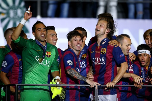 BERLIN, GERMANY - JUNE 06: Claudio Bravo, Lionel Messi and Ivan Rakitic of Barcelona celebrate victory after the UEFA Champions League Final between Juventus and FC Barcelona at Olympiastadion on June 6, 2015 in Berlin, Germany.  (Photo by Paul Gilham/Getty Images)