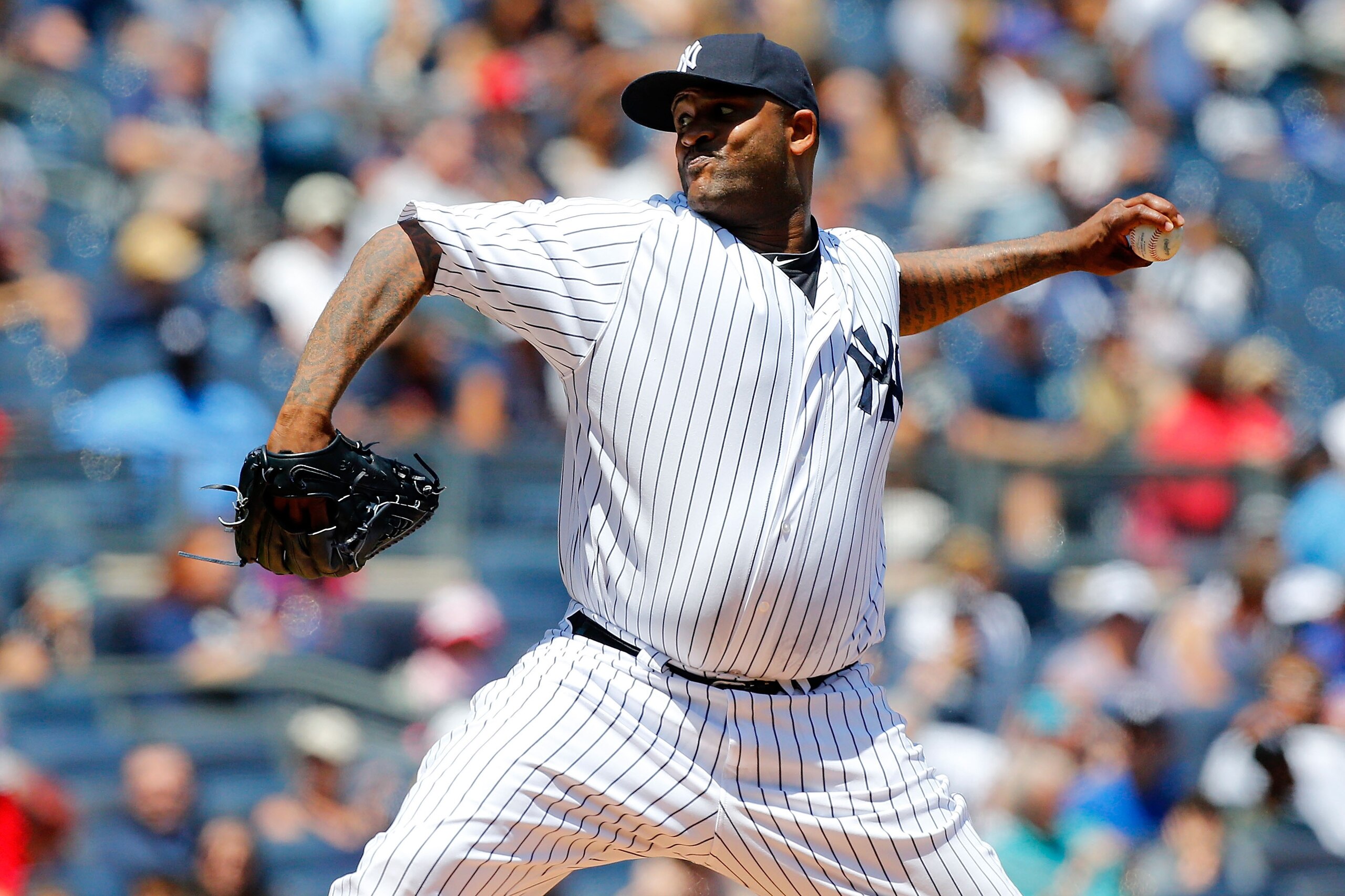 NEW YORK, NY - JUNE 07:  CC Sabathia #52 of the New York Yankees throws a pitch in the second inning against the Los Angeles Angels of Anaheim at Yankee Stadium on June 7, 2015 in the Bronx borough of New York City.  (Photo by Jim McIsaac/Getty Images)