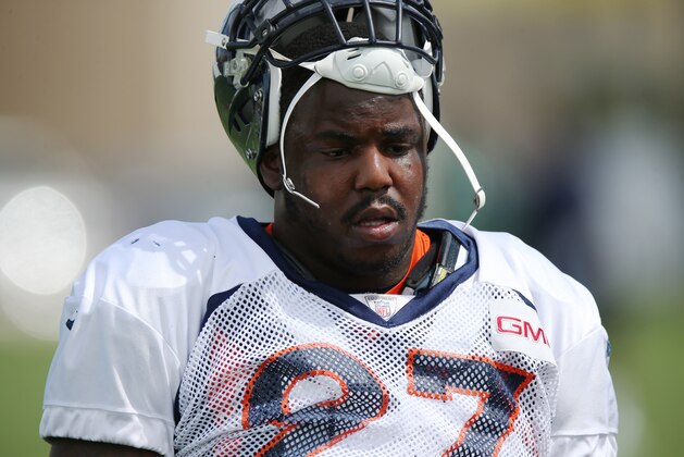 Denver Broncos defensive end Malik Jackson cools off during the morning session at the team's NFL training camp at Broncos headquarters in Englewood, Colo., on Friday, Aug. 1, 2014. (AP Photo/David Zalubowski)