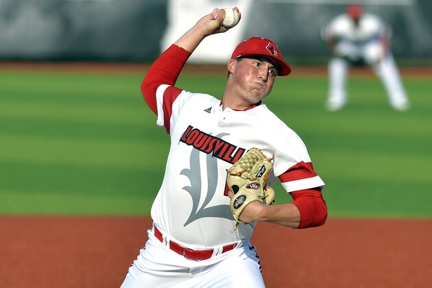 Louisville's Kyle Funkhouser pitches to a Kennesaw State batter in the second inning of an NCAA college baseball tournament super regional game in Louisville, Ky., Friday, June 6, 2014. (AP Photo/Timothy D. Easley)