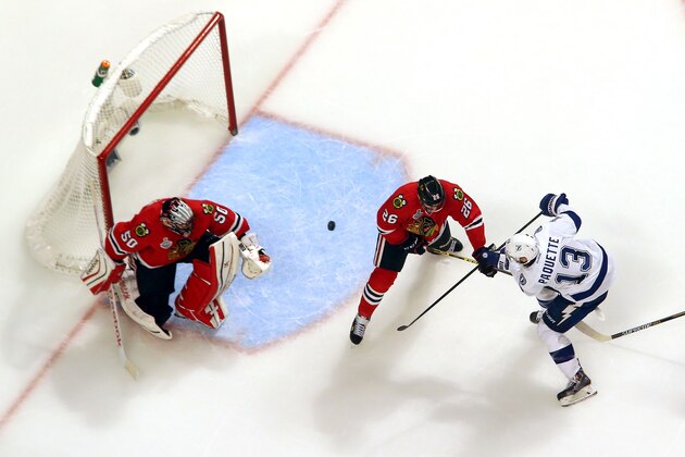 CHICAGO, IL - JUNE 08:  Cedric Paquette #13 of the Tampa Bay Lightning scores the game winning goal against the Chicago Blackhawks during Game Three of the 2015 NHL Stanley Cup Final at the United Center on June 8, 2015 in Chicago, Illinois. The Lightning defeated the Blackhawks 3-2.  (Photo by Bruce Bennett/Getty Images)