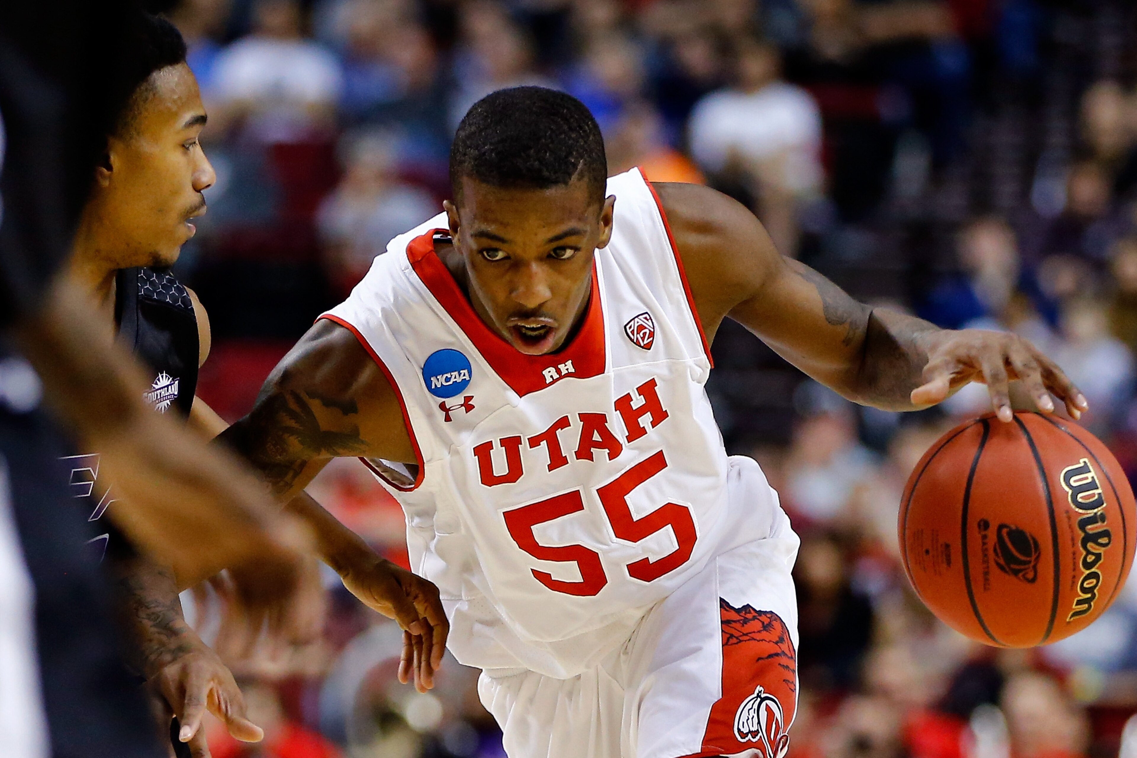 PORTLAND, OR - MARCH 19: Delon Wright #55 of the Utah Utes controls the ball in the first half against the Stephen F. Austin Lumberjacks during the second round of the 2015 NCAA Men's Basketball Tournament at Moda Center on March 19, 2015 in Portland, Oregon.  (Photo by Jonathan Ferrey/Getty Images)